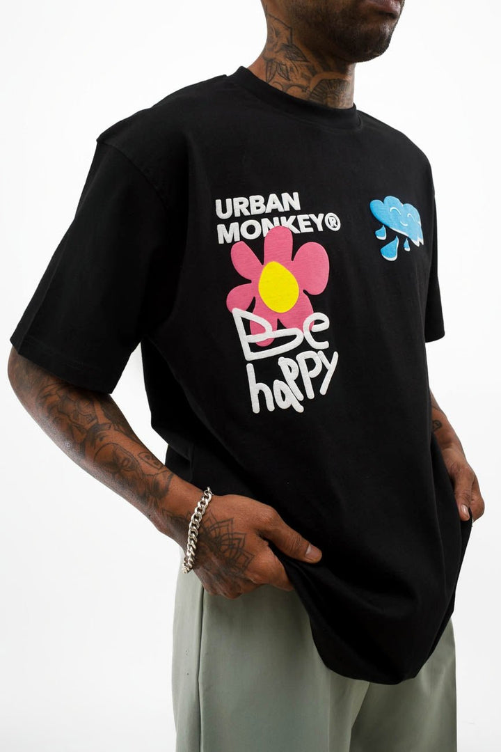 Black t-shirt with Urban monkey & be happy text in bold and big white letters.