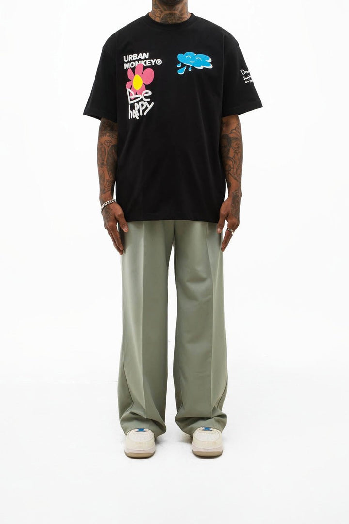 Black overized tshirt with green baggy trouser